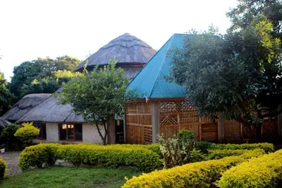a house with a building with a dome at Emanyatta Lodge in Monduli