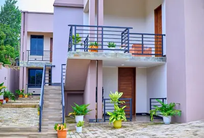 a house with a balcony with plants on it at Penthouse Moshono in Nkoanrua