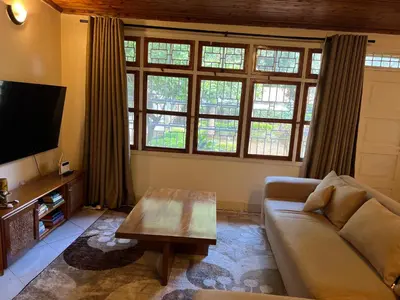 a living room with a couch and a coffee table at Nyani's hub in Moshi