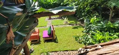 a miniature garden with chairs and a table at Kidep Maasai Village in Moshi