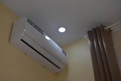a air conditioner hanging from the ceiling of a room at Volunteer House in Msaranga