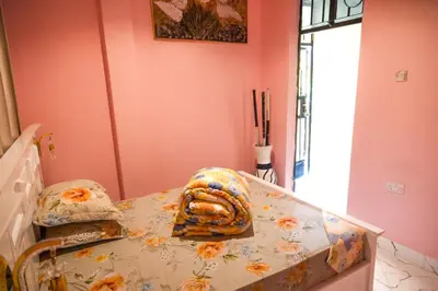 a room with a table with a skull pillow on it at Bienvenido a casa villa in Arusha