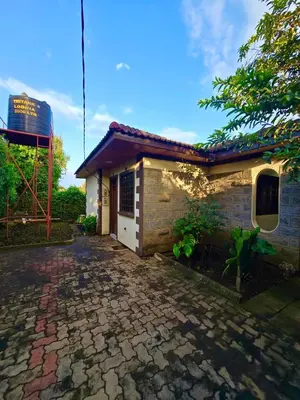 a small house with a brick driveway at 2 bedrooms cozy house in Arusha in Arusha