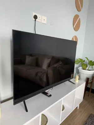 a large flat screen tv sitting on top of a table at Amaroz House in Nkunjila