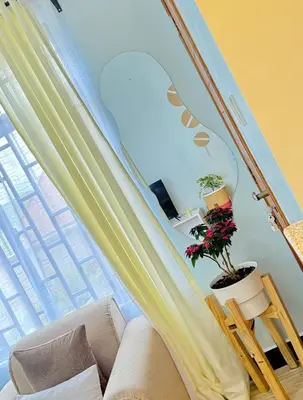 a living room with a couch and a window at Amaroz House in Nkunjila