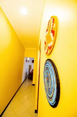 a wall with a picture of a mouth on a wall at Private Nest Apartment 2 in Arusha