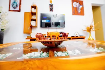 a glass table with a toy on a bowl on top of it at Private Nest Apartment 2 in Arusha