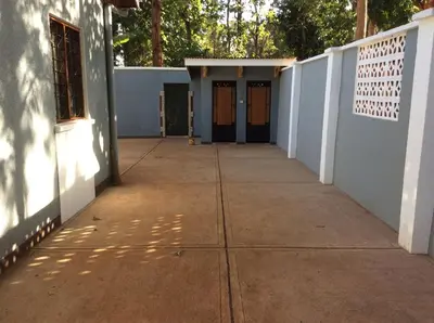 an empty hallway of a house with a white wall at Kitonga Escape in Msaranga