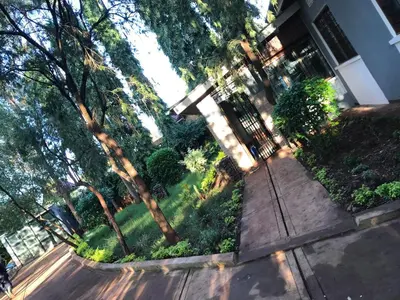 an aerial view of a house with trees and a sidewalk at Kitonga Escape in Msaranga
