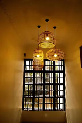 a window with two chandeliers hanging from a ceiling at The Hidden Valley Lodge in Arusha