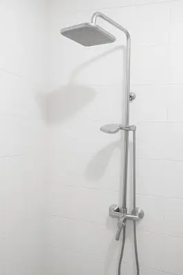 a shower with a shower head in a bathroom at Villa Malkia's in Enaboishu