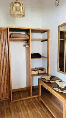 a room with wooden shelves and a table at Tulusia Lake View in Arusha
