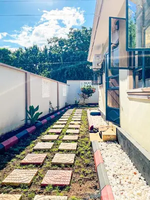 a garden in the middle of a building at Havijo Residence