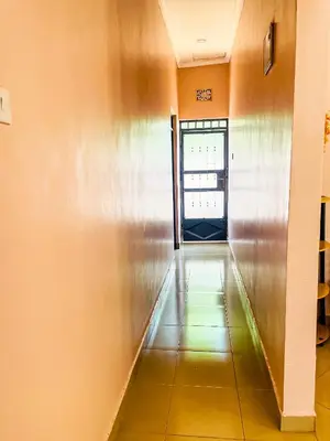 an empty hallway with a door in a building at Havijo Residence