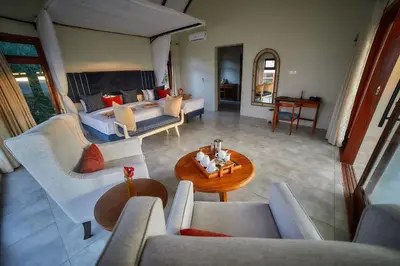 a living room with couches and a table at Tarangire Luxury Hideaway in Mbesi