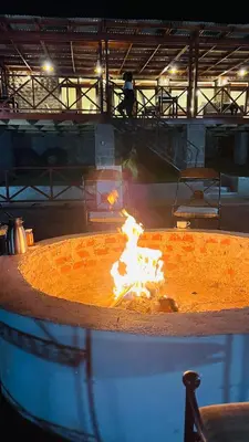 a large fire pit with flames in it at Mount Meru Baraka House