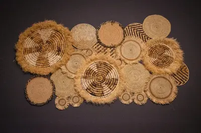 a group of straw hats on a table at Simba homes in Arusha