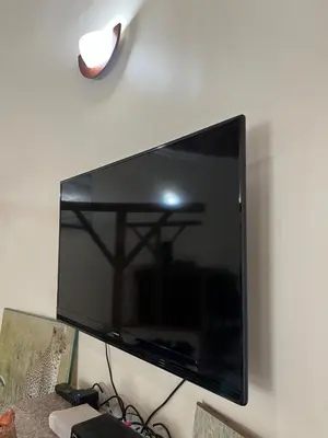 a large flat screen tv hanging on a wall at Nature's Haven Ilboru Hideaway in Arusha