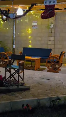 a group of chairs and a bench in a tent at Daima Escape in Usa River