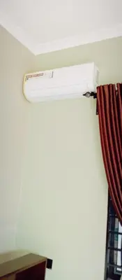 a air conditioner on the ceiling of a room at Elwood Lodge in Arusha