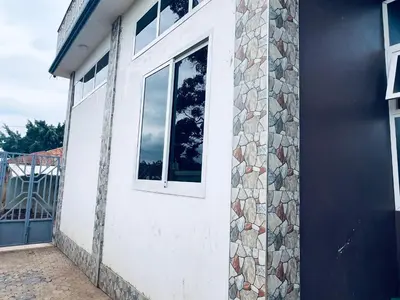 a building with a window on the side of it at Elly Villa Hotel in Moshi