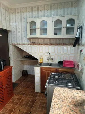 a kitchen with a sink and a stove in it at Cape Haven in Arusha