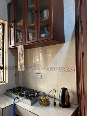 a kitchen with a stove and a counter top at Osim Homes in Arusha