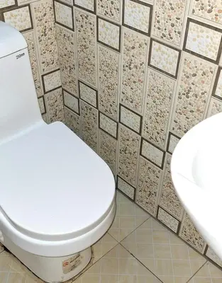 a bathroom with a toilet and a sink at World Heart Africa Experience in Arusha