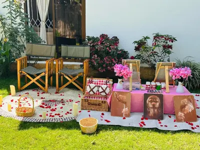 a table with a picture of a woman on it at A-Frame tiny house in Arusha