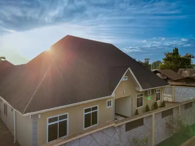 a house with a metal roof at Lavish Homestay in Msaranga