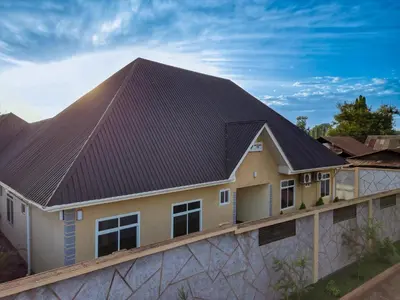 a house with a metal roof at Lavish Homestay in Msaranga