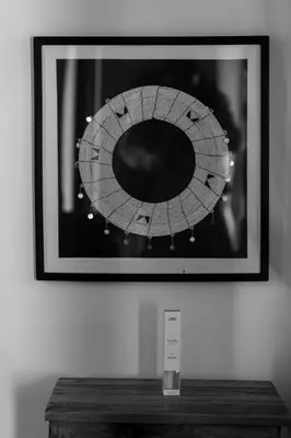 a picture of a mirror on a wall at White House Hostels - Arusha in Arusha