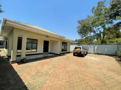 a car parked in front of a house at Emmalanta Homes in Arusha
