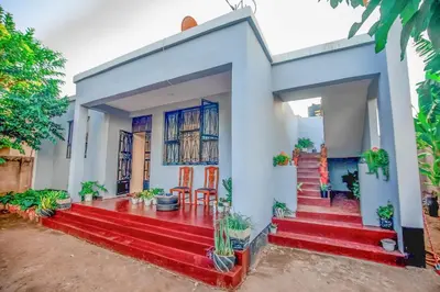 a house with red steps in front of it at Bantulaki House in Arusha