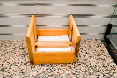 a wooden chair sitting on top of a table at Avek Home Stay Ngorongoro Room in Uru