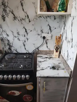 a kitchen with a stove and a counter top at othman homes in Arusha