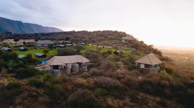 an aerial view of a village on a hill at Foot On Africa Safari Lodge in Mto wa Mbu