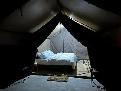 a bedroom with a bed in a tent at Namayana Camp in Makama