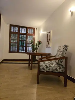 a room with a table and a chair and a window at Sprunger Retreat - tulia homes in Moshi