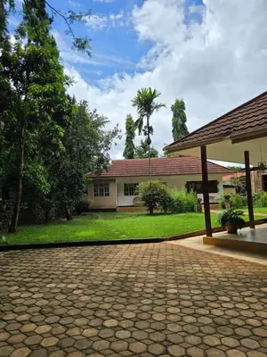 an empty driveway in front of a building at Sprunger Retreat - tulia homes in Moshi