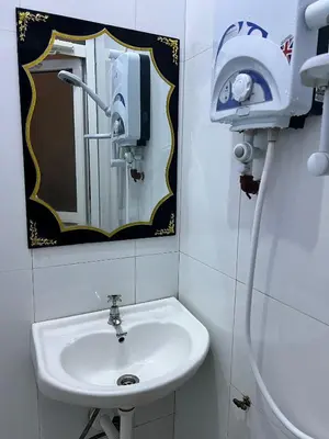 a bathroom with a sink and a mirror at Bushline Retreat in Karatu