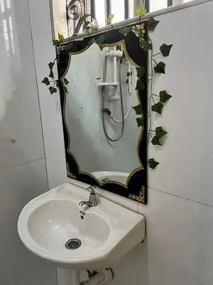 a bathroom with a sink and a mirror at Bushline Retreat in Karatu