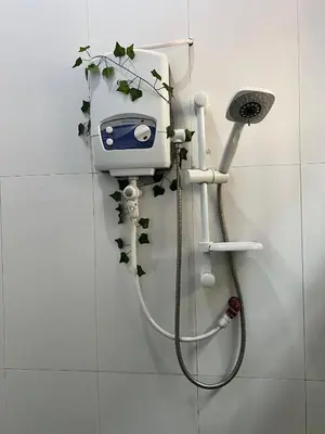 a shower in a bathroom with a toiler at Bushline Retreat in Karatu
