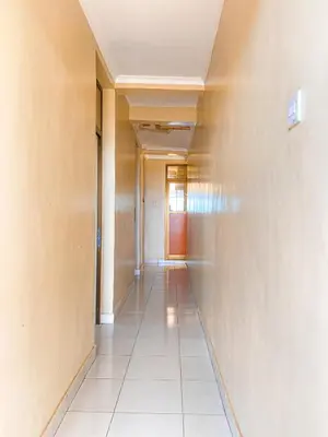 a corridor of an office building with a hallway at Kinyaiya's Sereniry Farmstay