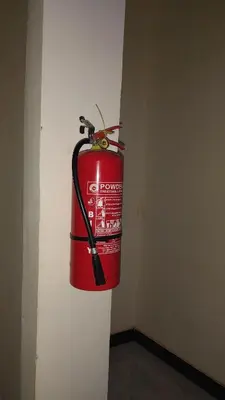 a fire hydrant is hanging on a wall at Hill Park Lodge Moshi in Shiri