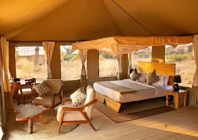 a bedroom with a bed in a tent at Tarangire Greenland Retreat in Kaiti