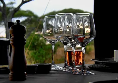 a group of wine glasses sitting on a table at Tarangire Greenland Retreat in Kaiti