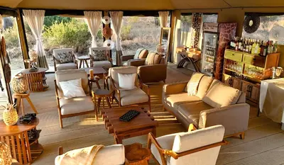 a store with a lot of chairs and tables at Tarangire Greenland Retreat in Kaiti