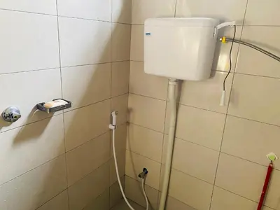 a shower in a bathroom with a toilet at Blessings Home in Arusha