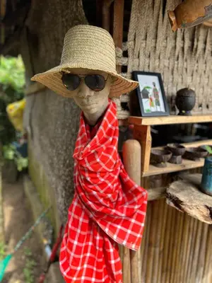 a statue of a woman wearing a hat and sunglasses at 1 Bedroom- Tranquil Meru Retreat in Nkoanrua